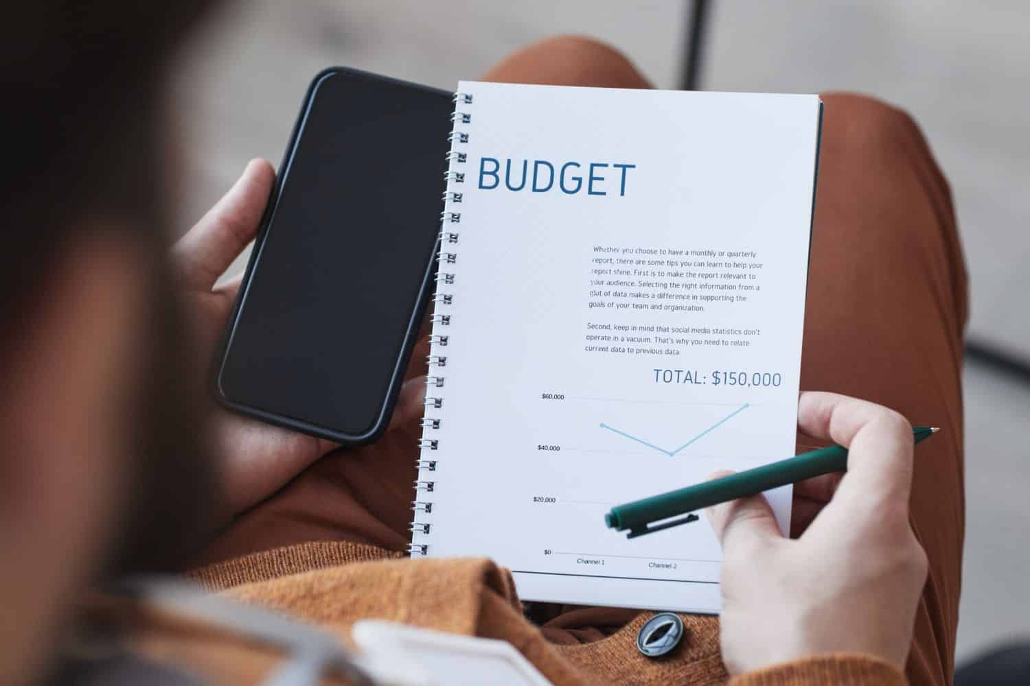 Businessman Planning with a Personal Budgeting Mobile App
