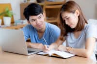 Calendarbudget q2 month 1 blog3 young couple calculate expenses finance with lap